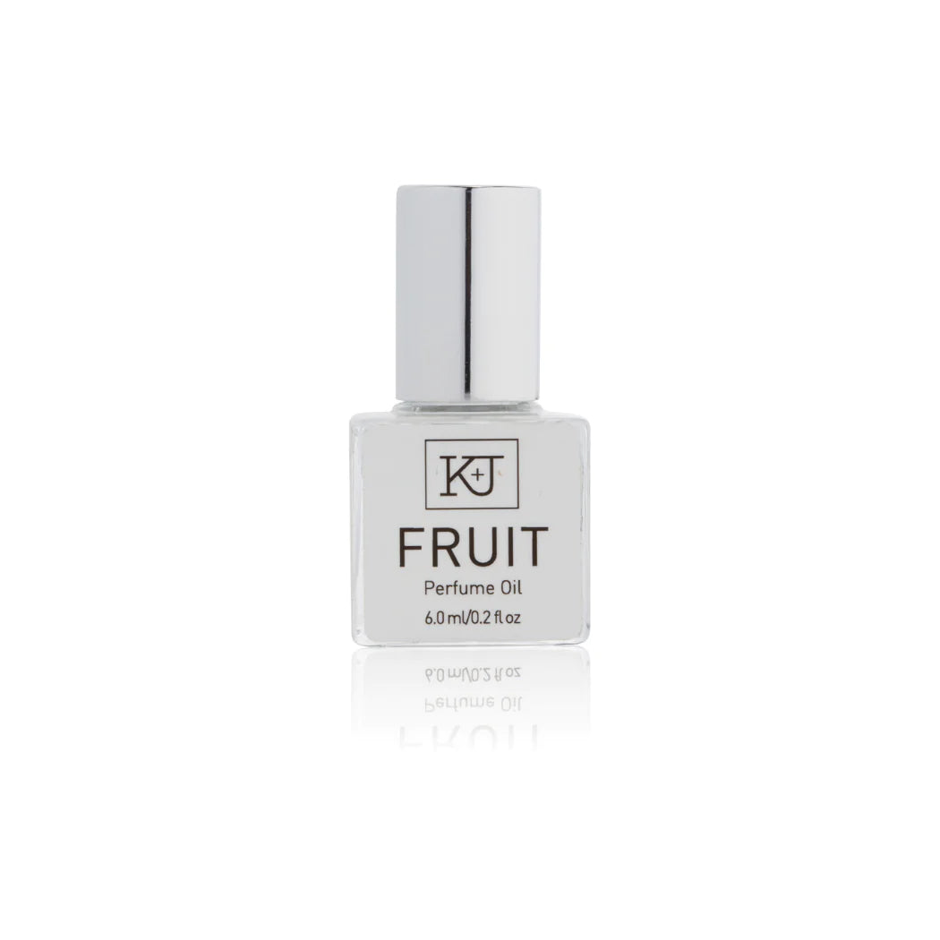 Kelly & Jones "FRUIT" perfume bottle: small, clear, square bottle with a long chrome lid top. Text reads "FRUIT Perfume Oil 6.0ml/0.2 fl oz"